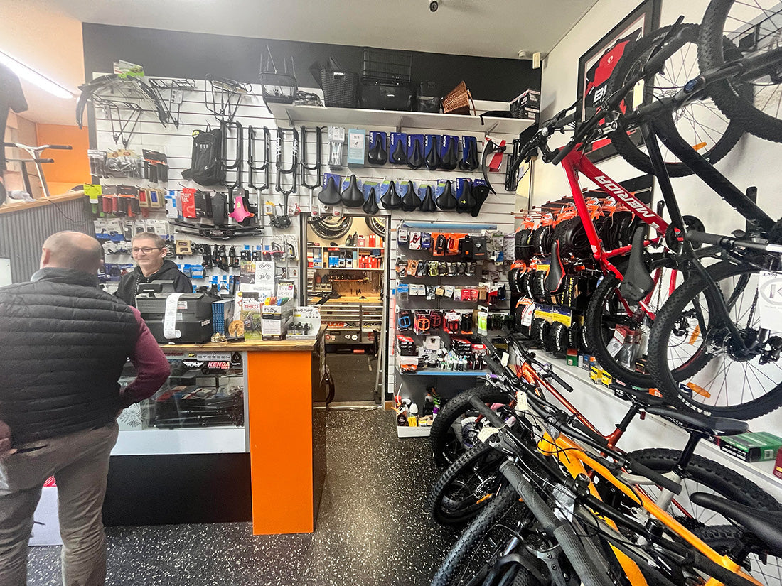 Bicycle Centre Burnie in Tasmania. The best bike shop in Tasmania, Australia. Store owner Brendon speaking to a local customer about bikes and the best local places to ride. 