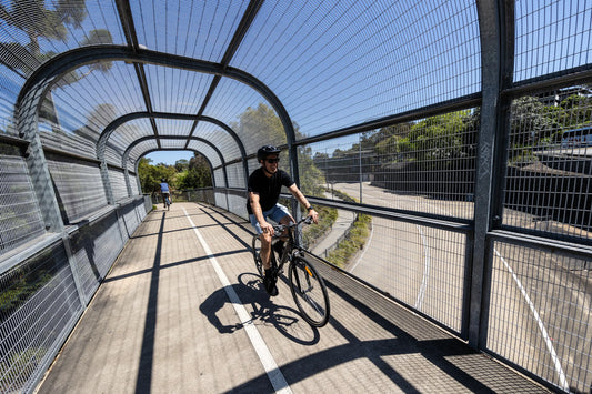 ride2work day is tomorrow. A man riding to work along the bike path in Brisbane. He is on the MERIDA Speeder,  The perfect bike for commuting