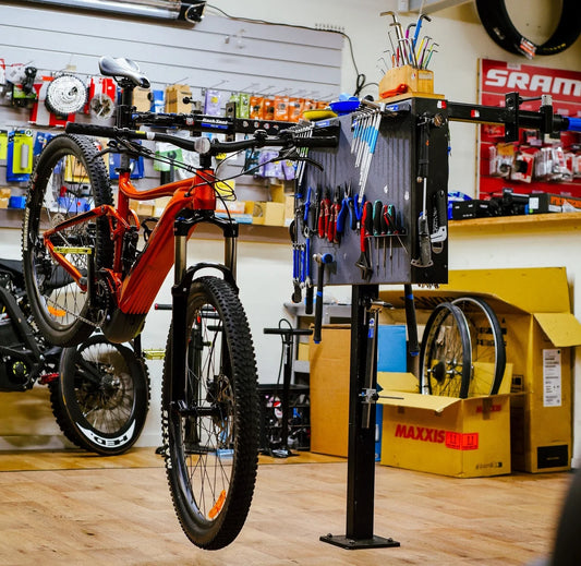 Bicycle Central on Marsh's workshop. Bike on the bike stand getting serviced by an expert bicycle mechanic. Bicycle Centre workshop and service. 